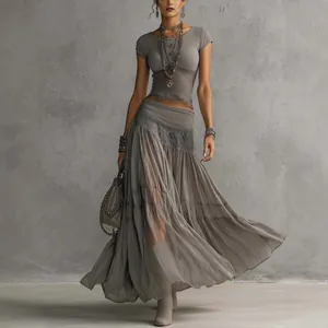 Elegant grey knit crop top and flowy chiffon maxi skirt two-piece set for women.