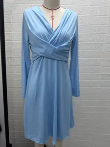 Light blue V-neck long sleeve midi dress with cross pleated waist detail on mannequin