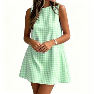 Close-up detail of a light green gingham sleeveless summer dress with a round neck profile