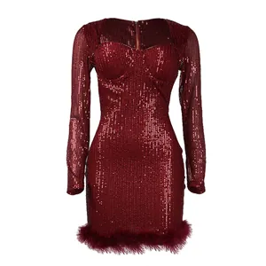 Detailed view of wine red sequin bodycon dress featuring elegant feather trim hem