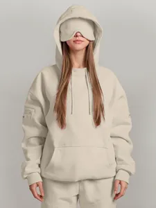 Minimalist solid beige oversized hoodie featuring a unique built-in sleep eye mask