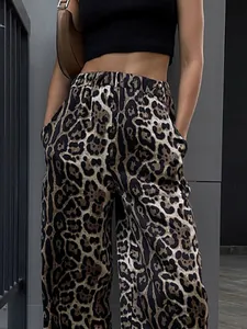 High-waisted leopard print wide-leg trousers with a relaxed, flowing street-style fit