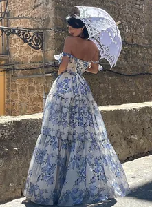 Elegant off-the-shoulder blue floral organza long evening dress with lace parasol.