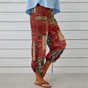 Side view of vintage ethnic print cotton linen harem pants showing the tapered ankle.