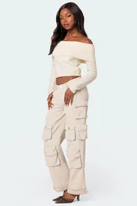 Chic cream off-shoulder knit top with long sleeves and ribbed fold-over collar detail