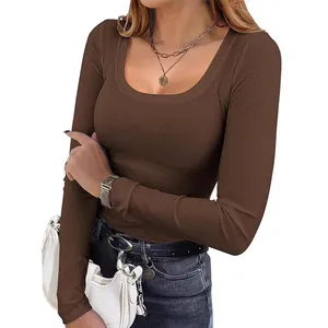 Elegant slim fit women's ribbed long sleeve t-shirt with a deep U-neck in brown color.