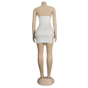Back view of slim fit dress featuring white panel and rhinestone sheer mesh sleeves