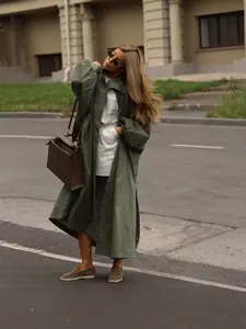 Elegant olive green oversized long trench coat with lantern sleeves and side slits