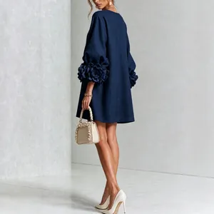 Navy blue French linen dress with 3D floral lantern sleeves shown from back view