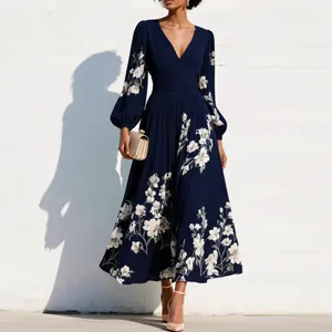 Elegant navy blue floral maxi dress featuring a pleated waist and sophisticated V-neckline detail