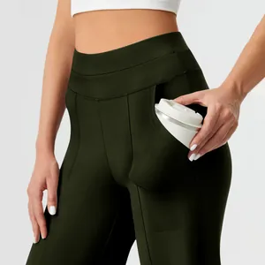 Detailed view of dark green high waisted yoga pants with a large functional side pocket
