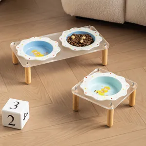 Flower ceramic pet bowl set with transparent acrylic stand and wooden legs.