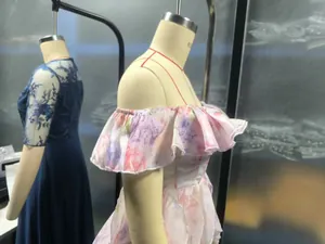 Detailed close-up of a French style floral print dress with layered ruffles