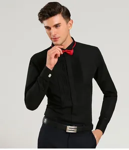 Professional detail of a black tuxedo shirt with red wing tip collar and bow tie.