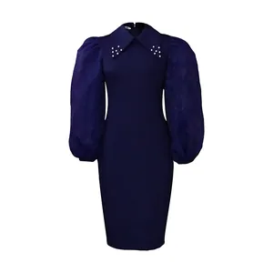 Frontal ghost mannequin view of a navy pencil dress with mesh sleeves and beaded collar