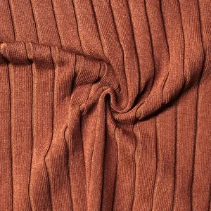 Close-up macro detail of rust-colored ribbed knit fabric texture for slim fit summer top