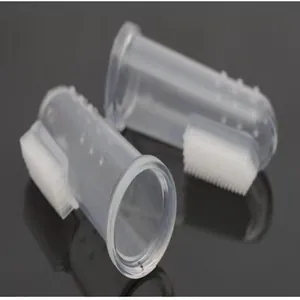 Detailed macro view of two clear silicone finger toothbrushes for dog and cat dental care.