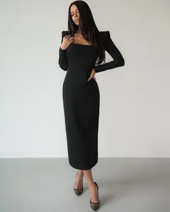 Elegant French style black long-sleeve midi dress with square neck and padded shoulders