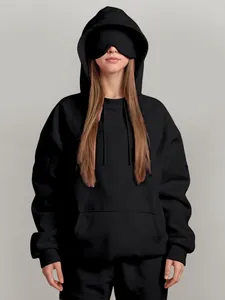 Oversized black hoodie featuring a unique built-in eye mask for casual winter comfort