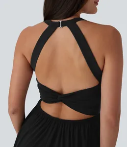 Detail view of a black backless halter dress with elegant twisted back and metal clasp