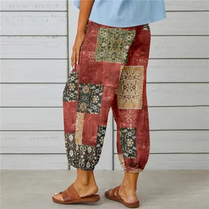 Detailed view of vintage patchwork printed linen pants featuring cuffed ankles for women