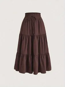 Detailed view of a brown tiered maxi cake skirt with drawstring elastic waist.