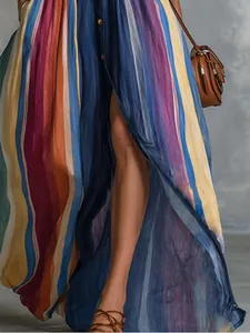 Detail view of a retro navy blue striped maxi skirt with high slit and vibrant colors.
