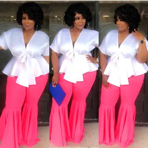 Two-piece set with white tie-front peplum top and pink pleated flare trousers