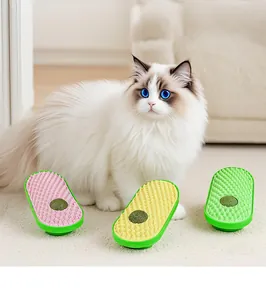Three colorful avocado-shaped cat self groomers with catnip balls and a fluffy cat.