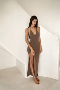 Elegant brown knitted halter maxi dress featuring a high side slit for summer beach wear