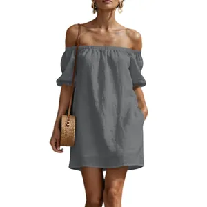 Detail of a grey off-the-shoulder cotton linen dress featuring elegant puff sleeves