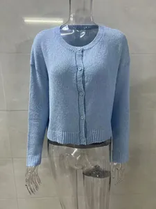 Close-up of a light blue long-sleeved round-neck knitted cardigan with buttons.