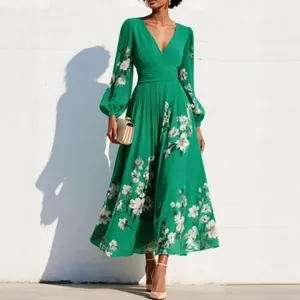 Detailed view of green floral V-neck pleated maxi dress with lantern sleeves