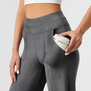 Detail of women's grey yoga pants featuring a functional side pocket for a coffee cup