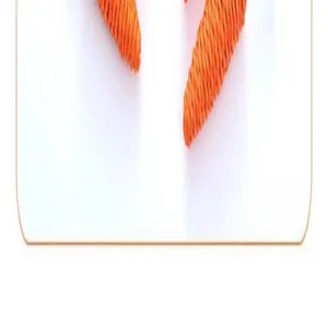Detailed macro view of an orange paper rope carrot cat toy showing durable woven texture