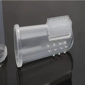 Close-up of the soft silicone bristles on a transparent finger toothbrush for pets
