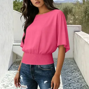 Detail of a bright pink casual short-sleeve top with smocked waist and round neck