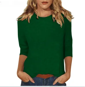 Women's green 3/4 sleeve crew neck T-shirt showing the soft fit and fabric details.