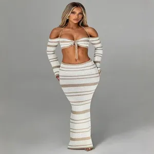 Chic striped crochet two-piece set featuring halter long sleeve top and maxi skirt