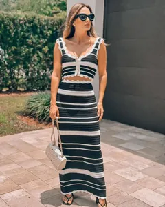 Detailed view of women's black and white striped crochet knit crop top and maxi skirt set