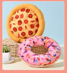 Detailed view showing a squeaky plush dog toy set with pizza and pink donut designs