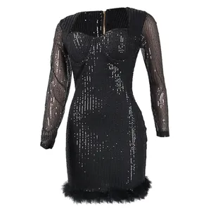 Detailed view of a sexy black sequin mini dress with long mesh sleeves and feather trim.