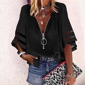Elegante camicia nera da donna con scollo a V, cerniera e maniche a campana in mesh