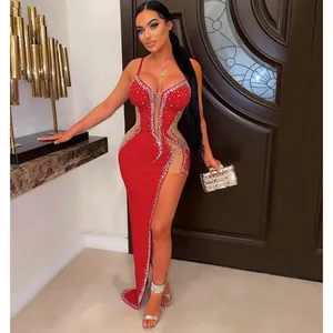 Elegant red rhinestone evening dress with sheer mesh panels and sexy high slit detail