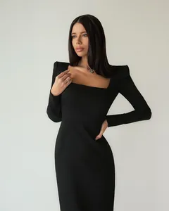 Elegant French style little black dress with square neck and structured padded shoulders