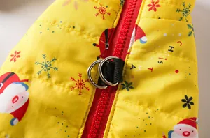 Close-up of Christmas dog vest with red zipper and metal leash attachment rings