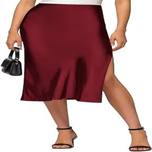 Close-up of an elegant burgundy satin midi skirt featuring a chic side slit design