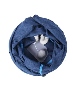 Detailed interior view of a foldable blue fabric cat tunnel featuring a plush ball.