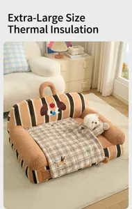 Cozy dog sofa bed with plaid blanket and matching pillow shown in a warm living room