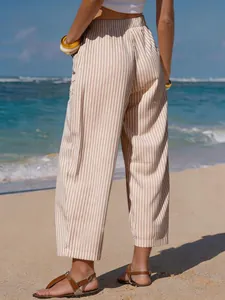 Detail view of women's stylish faux linen striped cropped pants for beach vacation